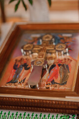 Wedding decoration in the church, crowns, wedding rings. Traditions