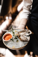 raw oyster is served in restaurant