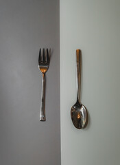 spoon and fork on a plain isolated background