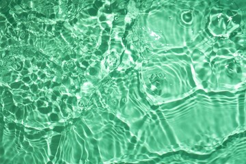 Soft focus cosmetic moisturizer water toner or emulsion emerald green herbal extract abstract background	