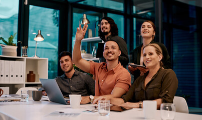The more you ask, the more you learn. Shot of a businessman raising his hand during a presentation in a boardroom.