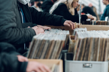 Man hands browsing vinyl album in a record store