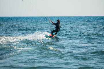 Woman kitesurfing on the ocean waters