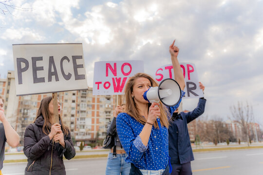 Shouting on the megaphone and protesting with her supporters