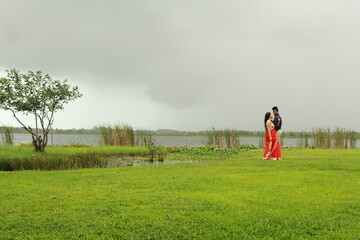 Fototapeta premium A beautiful moment with rainy weather. A loving couple looks at them