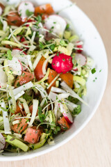 Raw salad with leak, tomato, radish, diet, vegan, vegetarian