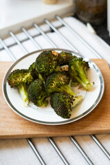 Roasted broccoli with some garlic on a plate