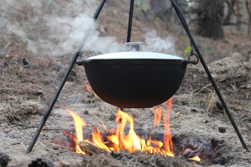 Cauldron on the fire. Cooking on fire.