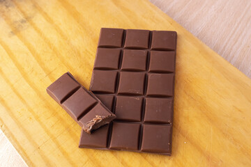 chocolate pieces on white background