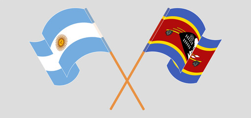 Crossed and waving flags of Argentina and Eswatini