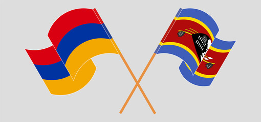 Crossed and waving flags of Armenia and Eswatini
