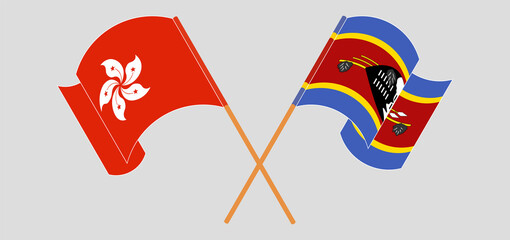 Crossed and waving flags of Hong Kong and Eswatini