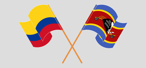 Crossed and waving flags of Colombia and Eswatini