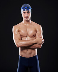 Assured of my pool prowess. Studio portrait of a young male swimmer.