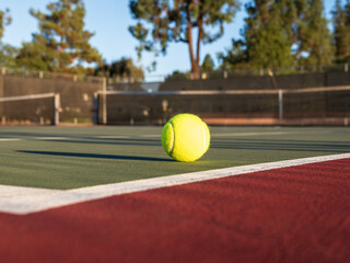 Yellow Tennis Ball on Green Center Court and Red Out of Bounds - obrazy, fototapety, plakaty