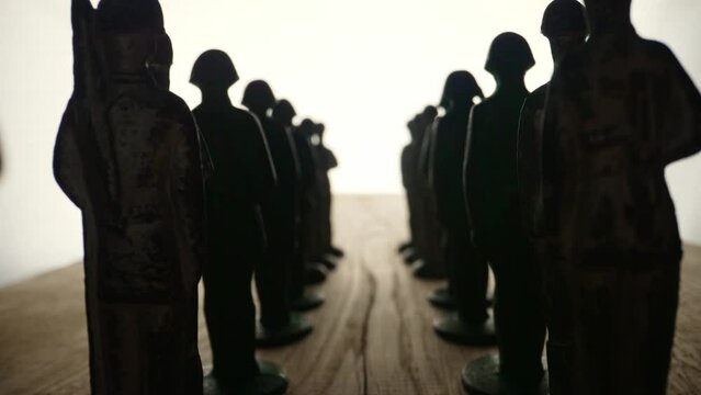 Toy tin soldiers in uniform. Vintage children's toys. Tin soldiers in the ranks.