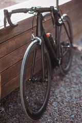 Fototapeta na wymiar Black sport bike for professional cycling standing outdoors
