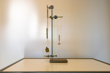System of pulleys, ropes and weights on a tripod. Used in physics class to demonstrate the concept...