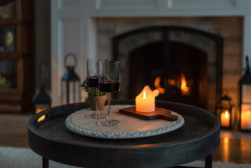 Two glasses of red wine at home by candlelight