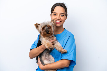 Young veterinarian woman with dog isolated on white background smiling a lot