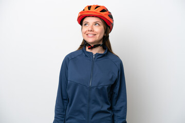 Young cyclist Lithuanian woman isolated on white background thinking an idea while looking up