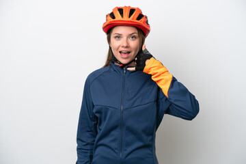 Young cyclist Lithuanian woman isolated on white background making phone gesture. Call me back sign