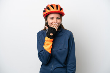 Young cyclist Lithuanian woman isolated on white background happy and smiling covering mouth with hand