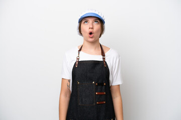 Fishmonger woman wearing an apron looking up and with surprised expression