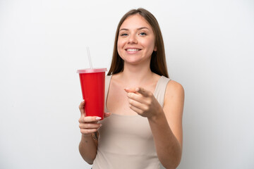 Young Lithuanian woman holding refreshment isolated on white background points finger at you with a confident expression