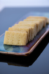 a row of shortbread cookies, intentional shallow depth of field