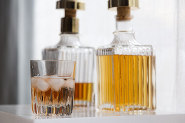 Obraz na płótnie Canvas Luxury glass bottles with different alcoholic spirits inside, copy space photo