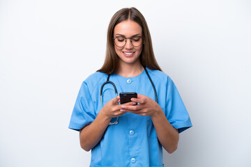 Young nurse caucasian woman isolated on white background sending a message with the mobile