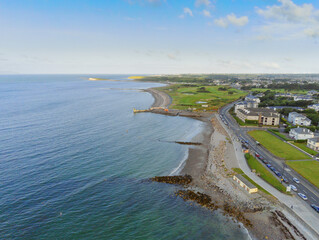 Aerial drone view on Salthill promenade, Galway, Ireland. Blue cloudy sky. Blackrock diving tower. Popular tourist area.