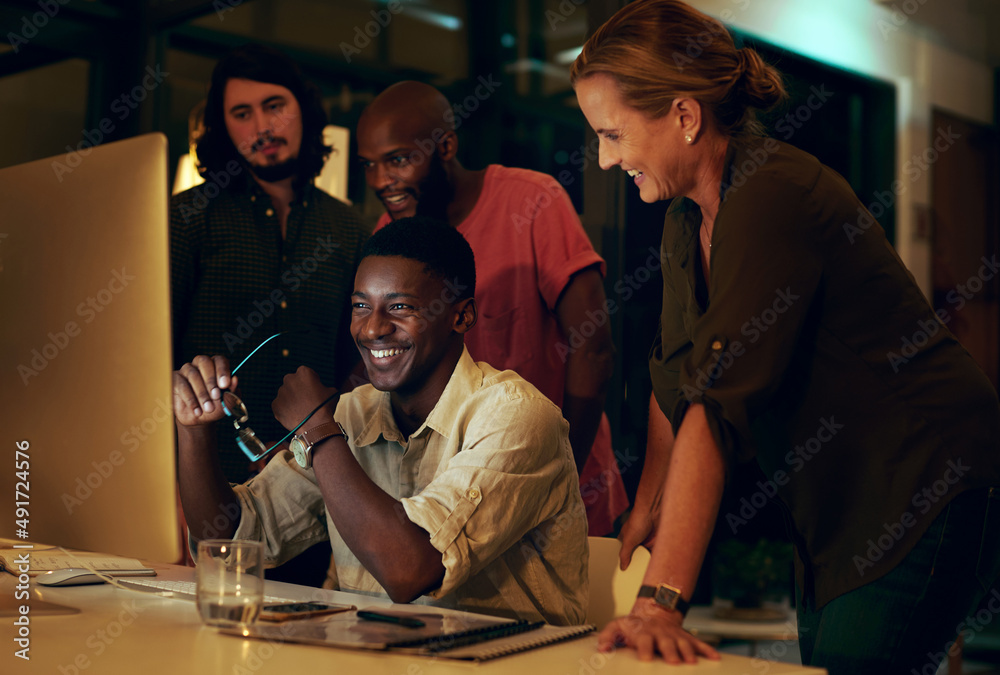 Poster great things happen when a team works together. shot of a group of businesspeople looking at somethi