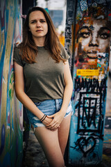 Naklejka premium Beautiful female street fashion model poses for the camera in the colorful streets of Miami - travel photography