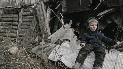 A child is crying^ playing in the ruins