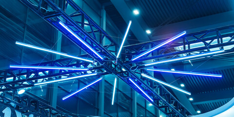 Lamps with diode lighting under the ceiling of a modern exhibition hall