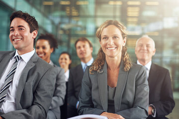 Its a positive presentation. Cropped shot of a group of businesspeople sitting in a presentation.