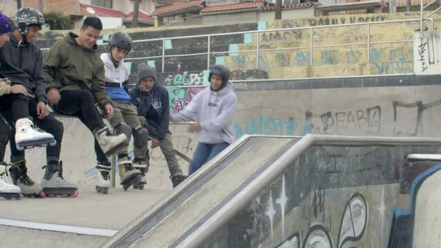 group of people at skatepark jumping and doing tricks