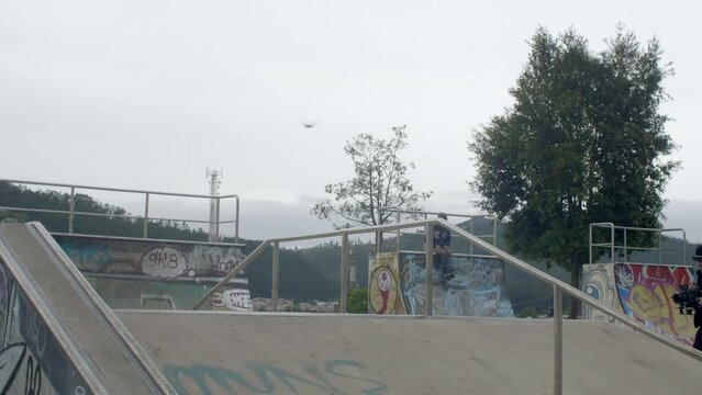 young boy jumps at skatepark