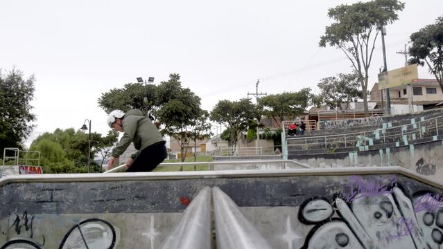 Rollerblader passes in front of camera at skatepark