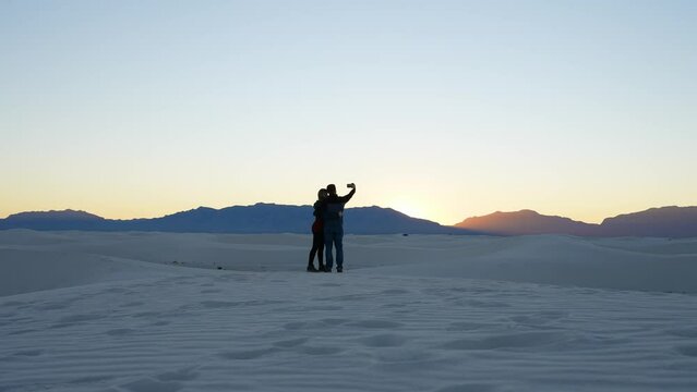 Two people taking a selfie in the white sands national park, New Mexico