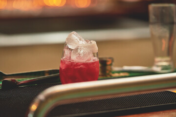 Female barman preparing drinks. cocktail bar Drinks at the bar. Fresh and cold drinks in a bar. Watermelon drink, jamiaca drink, margarita, micheladas.