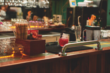 Female barman preparing drinks. cocktail bar Drinks at the bar. Fresh and cold drinks in a bar. Watermelon drink, jamiaca drink, margarita, micheladas.