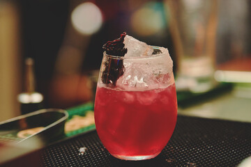 Female barman preparing drinks. cocktail bar Drinks at the bar. Fresh and cold drinks in a bar. Watermelon drink, jamiaca drink, margarita, micheladas.