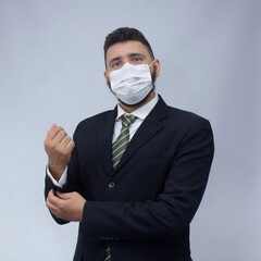 isolated businessman using mask to protect himself from viruses