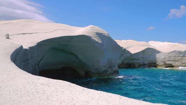 Sarakiniko Cliffs in slow motion on sunny summer day with no tourists on Milos island, Cyclades, Greece