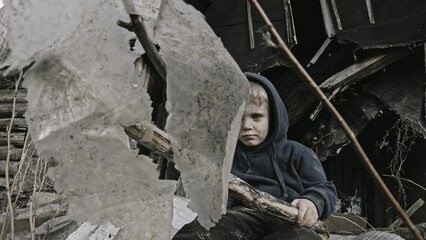 A child is crying^ playing in the ruins