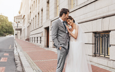 I married the one I cant go without. Shot of a beautiful couple out in the city on their wedding day.