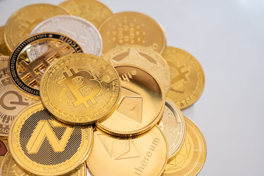 Chiang Rai, Thailand : 26-01-2022 : Close up of various kinds of cryptocurrency token coins. Cryptocurrency is a digital or virtual currency that is secured by cryptography.